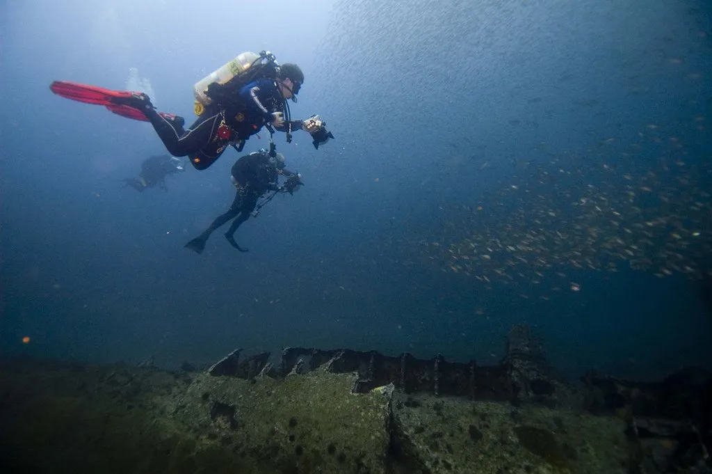 A diver above a wreck